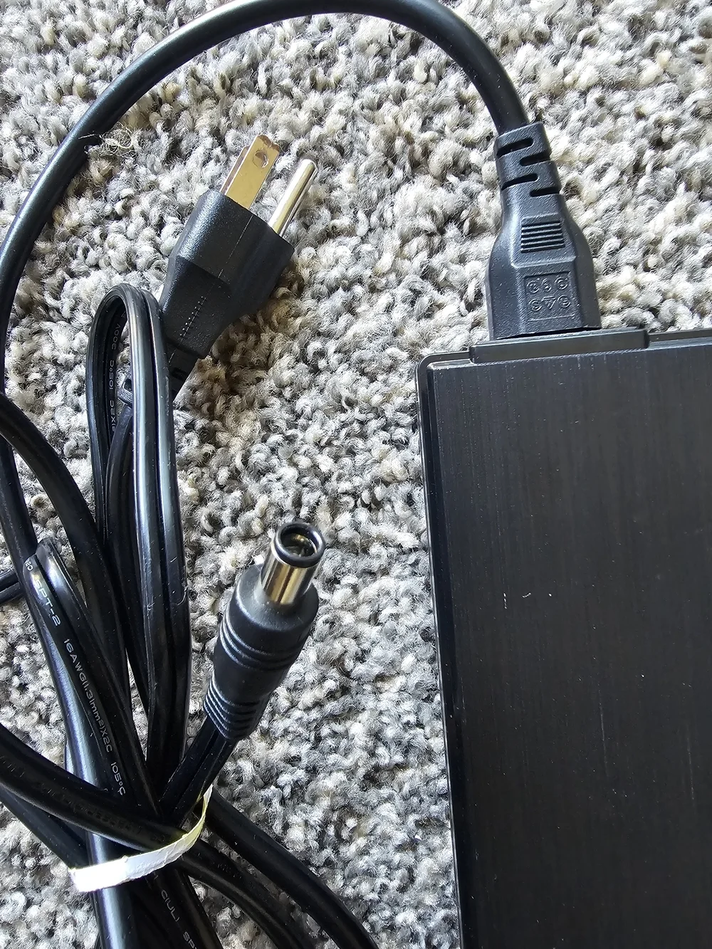 Shenzhen FJ-SW202821007150 switching power adapter.  Input: 100-240V~ 50/60Hz 3